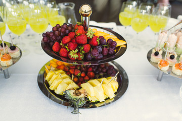 Fruit slicing at a banquet. Fruit slicing on a table at a party.
