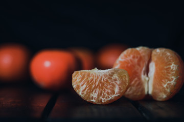 Fresh and ripe mandarins (tangerines, clementine) on black background