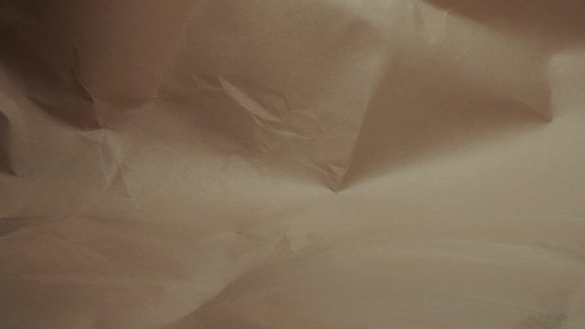 Crumpled paper background. Movement from left to right