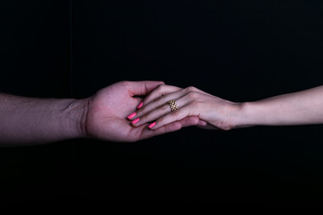 A view of man and women holding hands