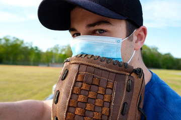 Images of young man wearing a COVID-19 mask at a closed baseball field.