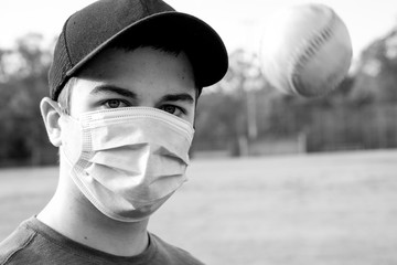 Images of young man wearing a COVID-19 mask at a closed baseball field.