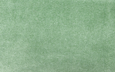 Fototapeta na wymiar green smooth fabric texture background