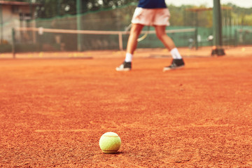 Men playing tennis match.