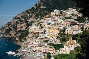 Naklejka premium Houses and hotels built on rocks in the beautiful city of Positano in Italy