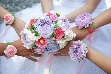 The Bridal bouquet holds a few hands