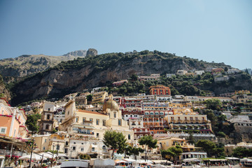Fototapeta na wymiar Houses and hotels built on rocks in the beautiful city of Positano in Italy
