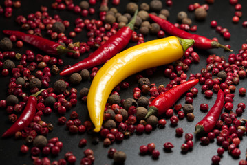 Red and yellow Pepper on a black background.