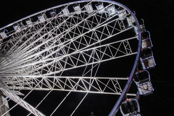 Large semi-permenent ferris wheel at night.