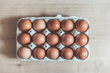 Eggs in a basket for morning breakfast or baking a cake, top view.