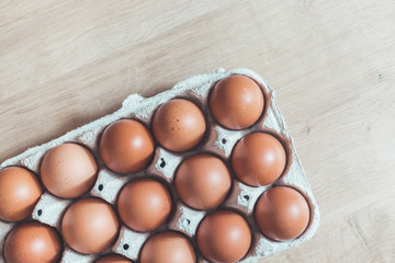 Eggs in a basket for morning breakfast or baking a cake, top view.