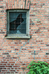 Broken window with bars, Sweden.