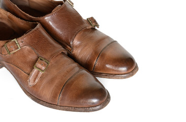 Brown leather shoes isolated on white background.