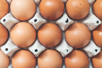 Eggs in a basket for morning breakfast or baking a cake, top view.