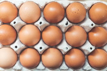 Eggs in a basket for morning breakfast or baking a cake, top view.