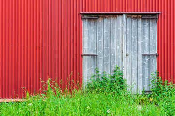 Wooden door on red barn