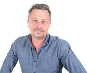 Portrait handsome middle aged man smiling against white background aside blank empty copy space