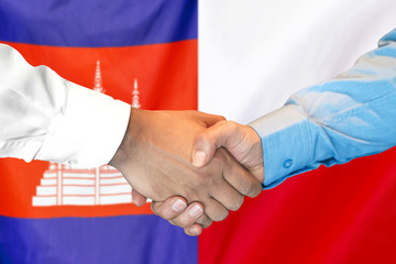 Handshake on Cambodia and Poland flag background. Support concept.