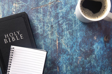 A Bible and Note Book for Study on a Blue Wooden Table