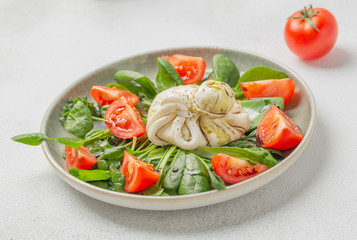 Burrata cheese. Salad with Italian burrata cheese, balsamic and cherry tomatoes.