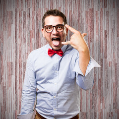 Man wearing a red bow tie. Rocker gesture.