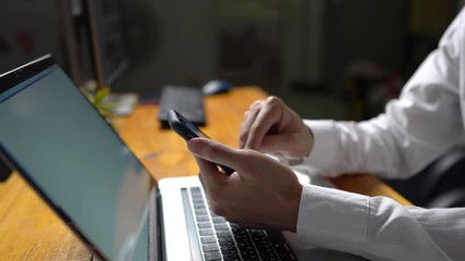 Close up Asian Young businessman using helpful mobile apps for business, time management organization concept.
 - Powered by Adobe