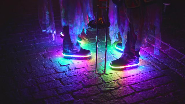 Kids wearing flashing colorful shoes, blinking in rainbow color