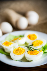 boiled eggs with salad leaves in a plate
