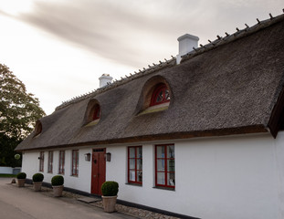 A beautiful old house with reed roof in Sweden.