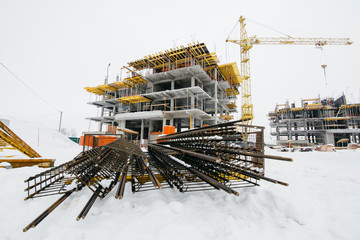 building under construction with crane