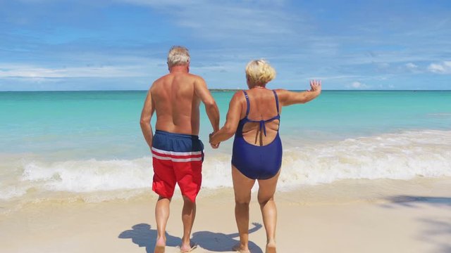 Active Senior Couple Running on Hawaii island in 4K slow motion 60fps
