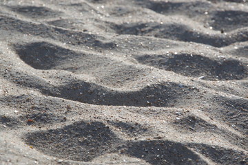 Sea sand close-up, mountains of sea sand on a sunny day, wallpaper, background.