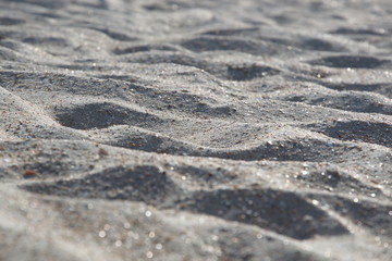 Sea sand close-up, mountains of sea sand on a sunny day, wallpaper, background.