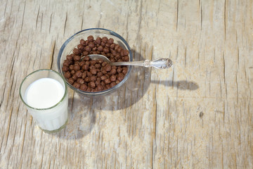 Breakfast of sweet cereals with milk