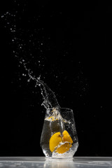  lemon water splash in a drinking glass