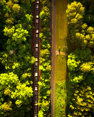 Aerial view of a road and traintracks in the country