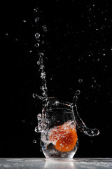 tomato water splash in a drinking glass