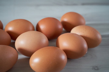 Organic eggs on a wooden background