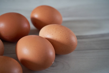 Organic eggs on a wooden background