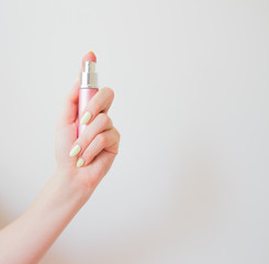  An individual antibacterial spray is used and carried by a woman in a bag. layout, copy spase