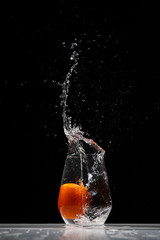 tomato water splash in a drinking glass