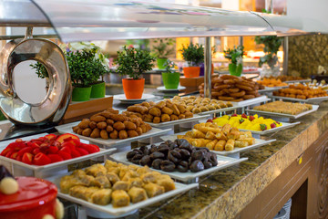 Traditional Turkish sweets at the open buffet in a hotel in Turkey