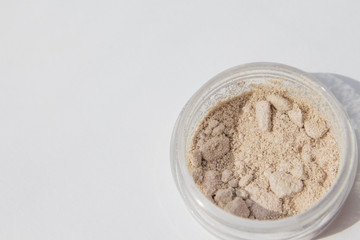 Texture of makeup powder - blush or eyeshadow. Mineral make-up cosmetics close-up isolated on white background
