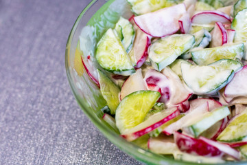 spring salad of radish and cucumber seasoned with sauce,