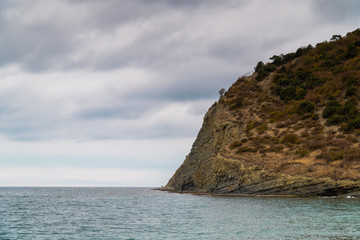 Naklejka premium Rocky black sea coast in the vicinity of lake Abrau near Novorossiysk.