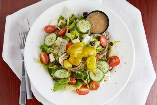 A classic greek salad with feta and pepperoncini