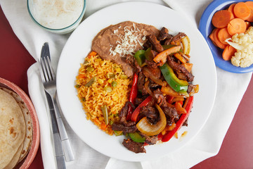 A traditional plate of Mexican style steak fajitas