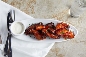 Honey glazed chicken wings and dipping sauce