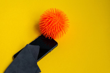 cleaning mobile phones with a disinfectant on napkins to prevent the safety of the Covid-19 virus...