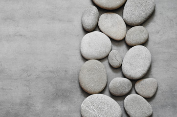 Fototapeta na wymiar gray spa stones and grey background.